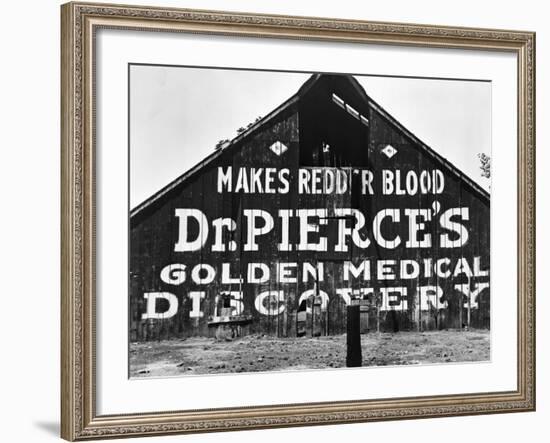 Patent Medicine Sign on A Barn-Dorothea Lange-Framed Photographic Print