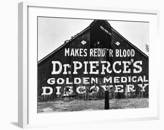 Patent Medicine Sign on A Barn-Dorothea Lange-Framed Photographic Print