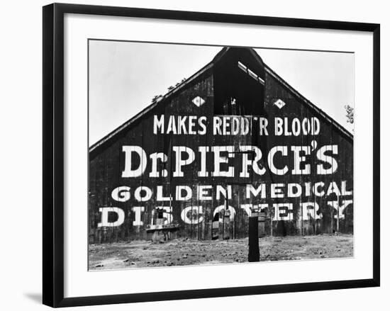 Patent Medicine Sign on A Barn-Dorothea Lange-Framed Photographic Print