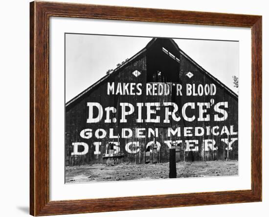 Patent Medicine Sign on A Barn-Dorothea Lange-Framed Photographic Print