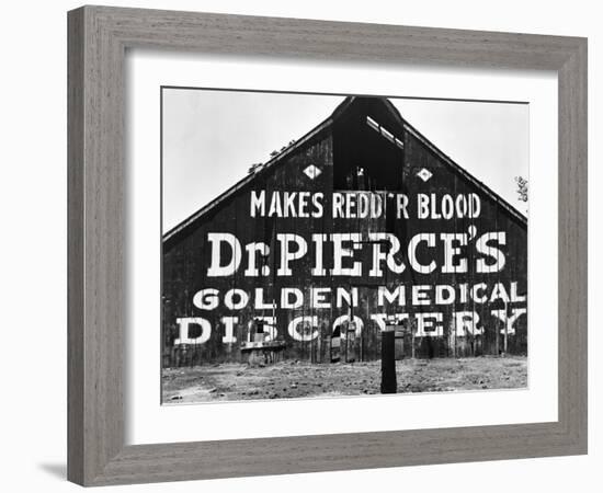 Patent Medicine Sign on A Barn-Dorothea Lange-Framed Photographic Print