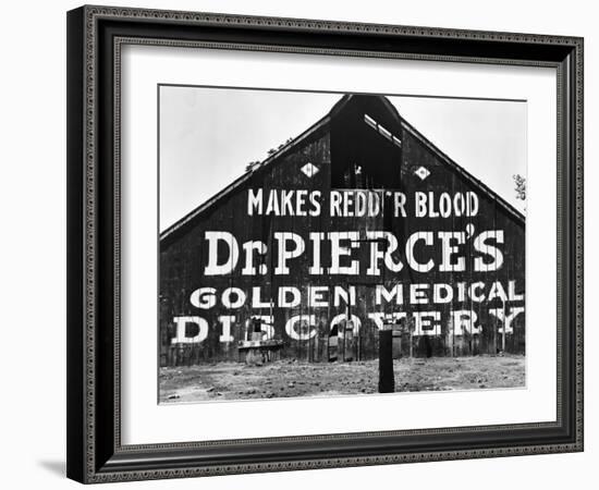 Patent Medicine Sign on A Barn-Dorothea Lange-Framed Photographic Print