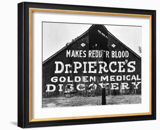 Patent Medicine Sign on A Barn-Dorothea Lange-Framed Photographic Print