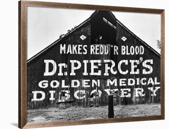 Patent Medicine Sign on A Barn-Dorothea Lange-Framed Photographic Print