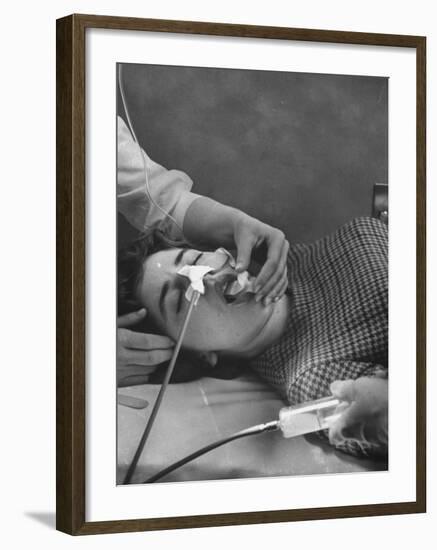 Patient Having Stomach Pumped after Poisoning by Overdose of Tranquilizers-Ralph Morse-Framed Photographic Print