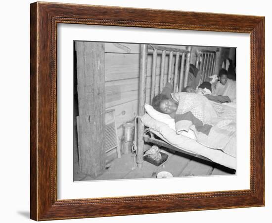 Patient in a Red Cross temporary infirmary for flood refugees at Forrest City, Arkansas, 1937-Walker Evans-Framed Photographic Print