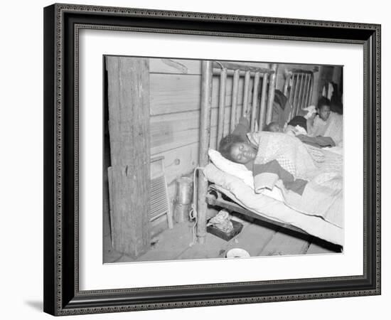 Patient in a Red Cross temporary infirmary for flood refugees at Forrest City, Arkansas, 1937-Walker Evans-Framed Photographic Print