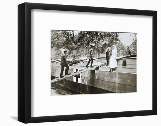 Patients being taken on board a hospital barge, Somme campaign, France, World War I, 1916-Unknown-Framed Photographic Print