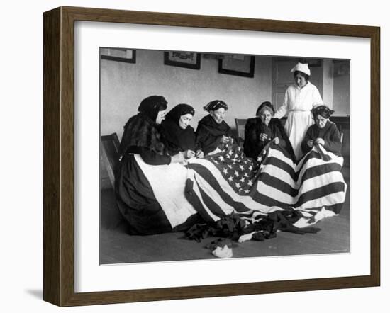 Patriotic Old Female Immigrants Sewing an American Flag under Supervision of Instructor Rose Radin-null-Framed Photographic Print