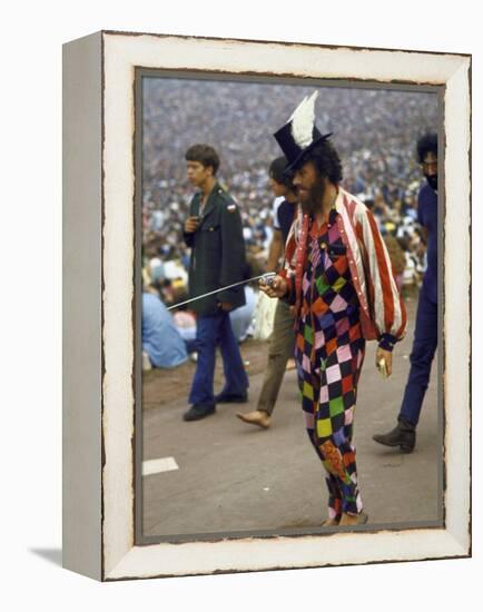 Paul Foster Walking During the Woodstock Music and Art Festival-Bill Eppridge-Framed Premier Image Canvas