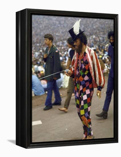 Paul Foster Walking During the Woodstock Music and Art Festival-Bill Eppridge-Framed Premier Image Canvas