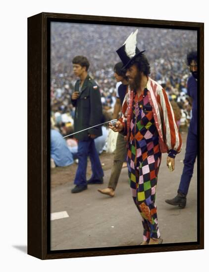 Paul Foster Walking During the Woodstock Music and Art Festival-Bill Eppridge-Framed Premier Image Canvas