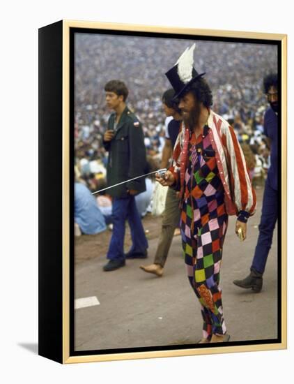 Paul Foster Walking During the Woodstock Music and Art Festival-Bill Eppridge-Framed Premier Image Canvas