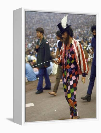 Paul Foster Walking During the Woodstock Music and Art Festival-Bill Eppridge-Framed Premier Image Canvas