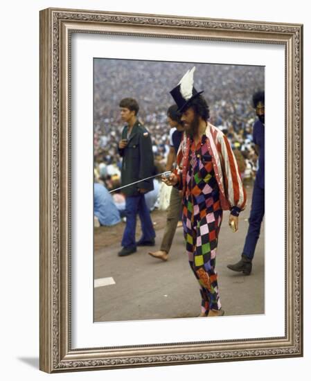 Paul Foster Walking During the Woodstock Music and Art Festival-Bill Eppridge-Framed Photographic Print