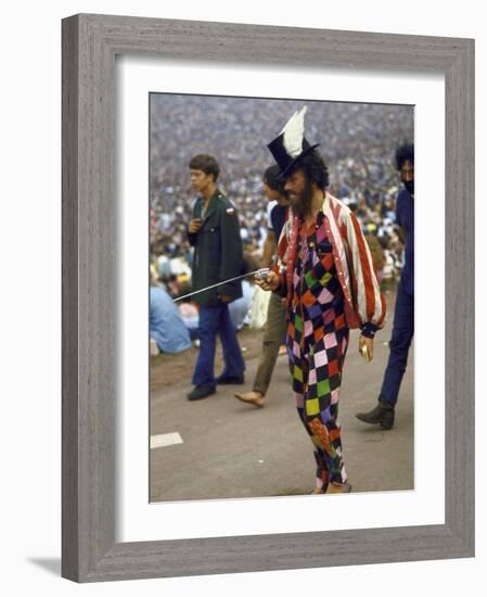 Paul Foster Walking During the Woodstock Music and Art Festival-Bill Eppridge-Framed Photographic Print