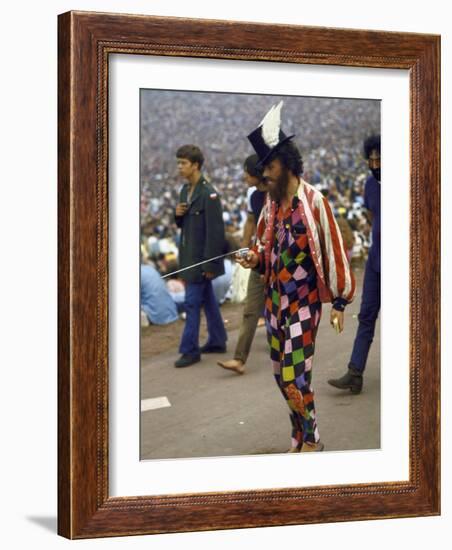 Paul Foster Walking During the Woodstock Music and Art Festival-Bill Eppridge-Framed Photographic Print