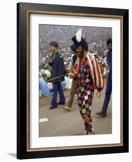 Paul Foster Walking During the Woodstock Music and Art Festival-Bill Eppridge-Framed Photographic Print