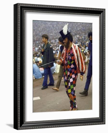 Paul Foster Walking During the Woodstock Music and Art Festival-Bill Eppridge-Framed Photographic Print