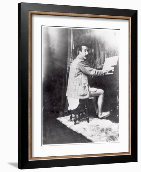 Paul Gauguin (1848-1903) Playing the Harmonium in Mucha's Studio, c.1895-Alphonse Mucha-Framed Photographic Print