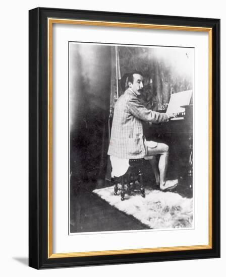 Paul Gauguin (1848-1903) Playing the Harmonium in Mucha's Studio, c.1895-Alphonse Mucha-Framed Photographic Print