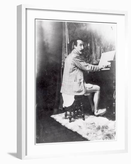 Paul Gauguin (1848-1903) Playing the Harmonium in Mucha's Studio, c.1895-Alphonse Mucha-Framed Photographic Print