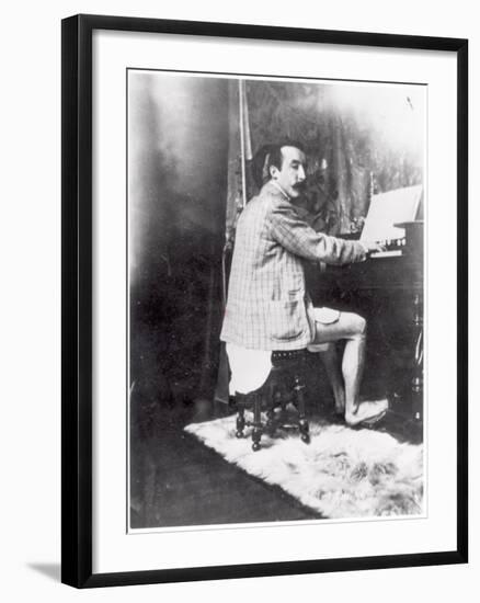 Paul Gauguin (1848-1903) Playing the Harmonium in Mucha's Studio, c.1895-Alphonse Mucha-Framed Photographic Print