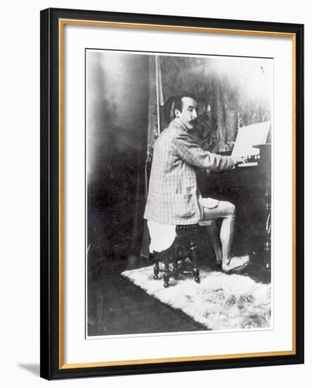 Paul Gauguin (1848-1903) Playing the Harmonium in Mucha's Studio, c.1895-Alphonse Mucha-Framed Photographic Print