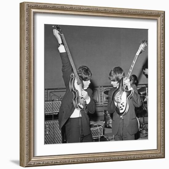 Paul Mccartney and George Harrison Tune their Guitars-Associated Newspapers-Framed Photo