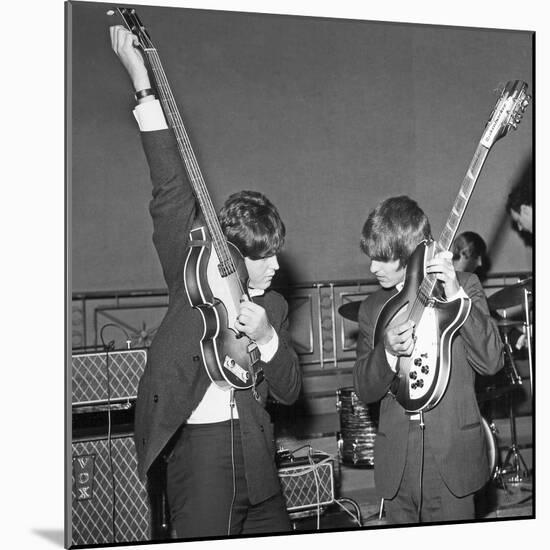 Paul Mccartney and George Harrison Tune their Guitars-Associated Newspapers-Mounted Photo