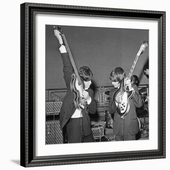 Paul Mccartney and George Harrison Tune their Guitars-Associated Newspapers-Framed Photo