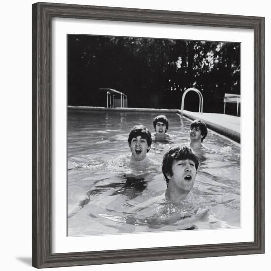 Paul McCartney, George Harrison, John Lennon and Ringo Starr Taking a Dip in a Swimming Pool-null-Framed Photographic Print