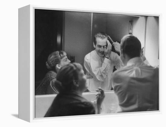 Paul Newman Talking to His Wife Joanne Woodward While Getting Dressed-Gordon Parks-Framed Premier Image Canvas