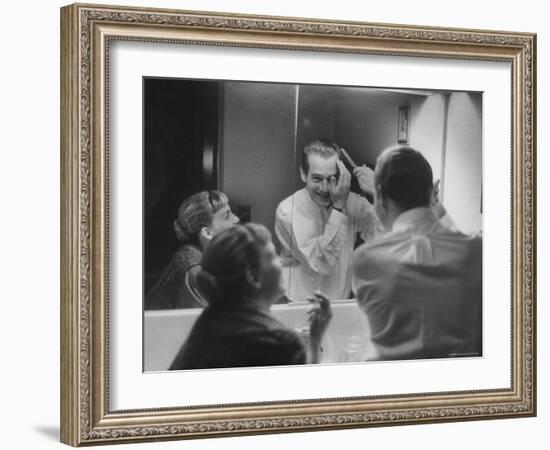 Paul Newman Talking to His Wife Joanne Woodward While Getting Dressed-Gordon Parks-Framed Premium Photographic Print