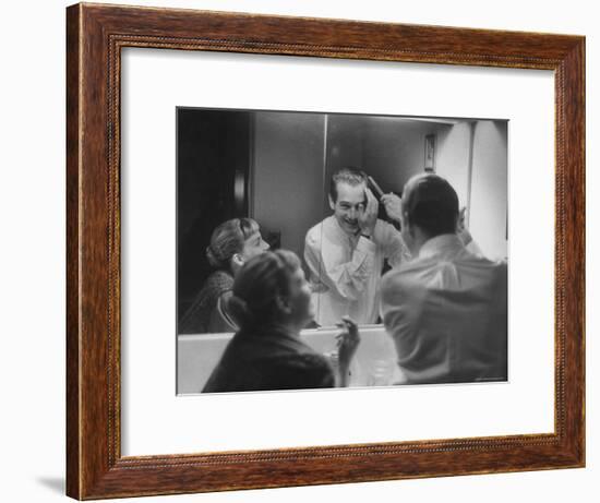 Paul Newman Talking to His Wife Joanne Woodward While Getting Dressed-Gordon Parks-Framed Premium Photographic Print