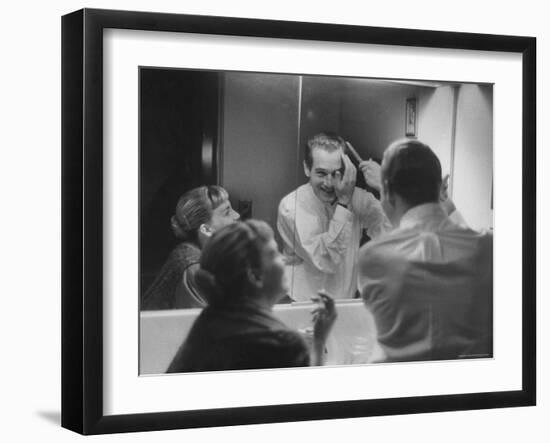 Paul Newman Talking to His Wife Joanne Woodward While Getting Dressed-Gordon Parks-Framed Premium Photographic Print
