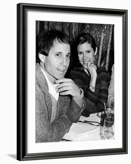 Paul Simon with Girlfriend, Carrie Fisher, at Party for Fisher's Dad, Singer Eddie Fisher-David Mcgough-Framed Premium Photographic Print