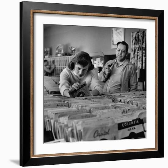 Pay in Trade Taken by High School Music Store Worker Margaret High, Spending Salary on Records-Nina Leen-Framed Photographic Print