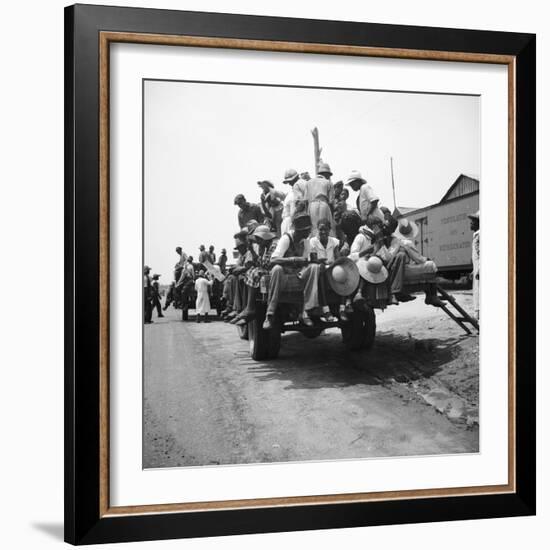 Peach pickers being driven to the orchards in Muscella, Georgia, 1936-Dorothea Lange-Framed Photographic Print