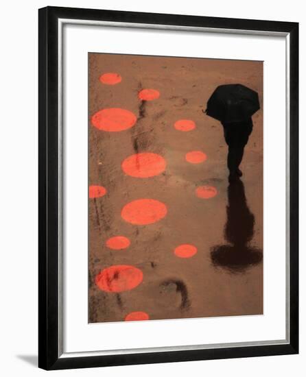 Pedestrian Makes His Way in New York's Times Square in the Rain-null-Framed Photographic Print