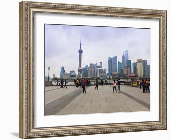 Pedestrians and Tourists on the Bund, the Futuristic Skyline of Pudong across the Huangpu River Bey-Amanda Hall-Framed Photographic Print