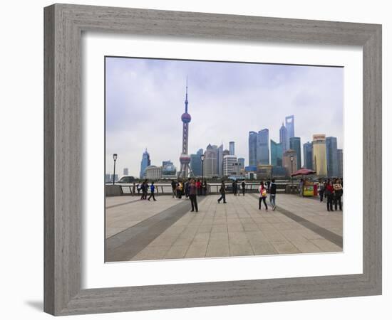 Pedestrians and Tourists on the Bund, the Futuristic Skyline of Pudong across the Huangpu River Bey-Amanda Hall-Framed Photographic Print