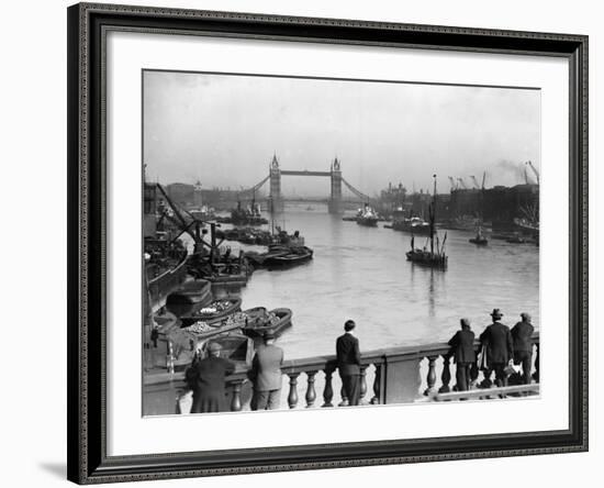 Pedestrians on London Bridge Watch Boats and Barges Being Unloaded-null-Framed Photographic Print
