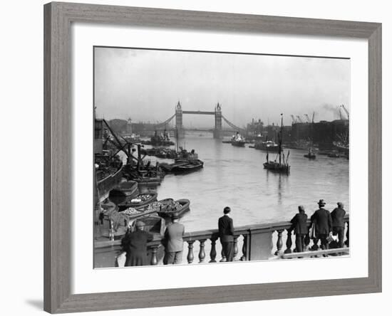 Pedestrians on London Bridge Watch Boats and Barges Being Unloaded-null-Framed Photographic Print