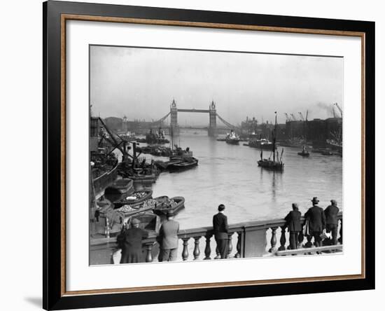 Pedestrians on London Bridge Watch Boats and Barges Being Unloaded-null-Framed Photographic Print