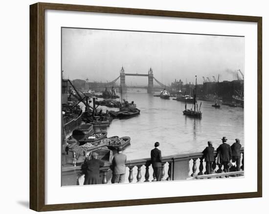 Pedestrians on London Bridge Watch Boats and Barges Being Unloaded--Framed Photographic Print