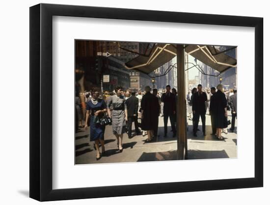 Pedestrians Reflected in Glass on 7th Ave in the Garment District, New York, New York, 1960-Walter Sanders-Framed Photographic Print