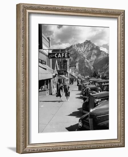 Pedestrians Walking Along Main Street in Resort Town with Cascade Mountain in the Background-Andreas Feininger-Framed Photographic Print