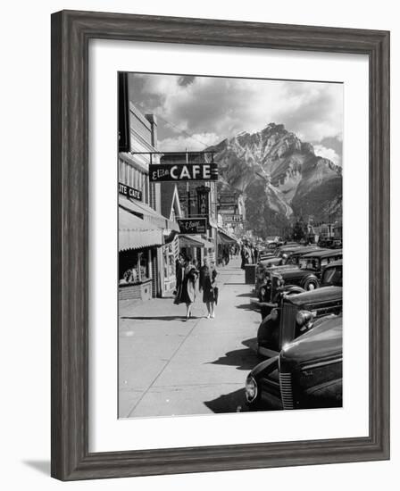 Pedestrians Walking Along Main Street in Resort Town with Cascade Mountain in the Background-Andreas Feininger-Framed Photographic Print