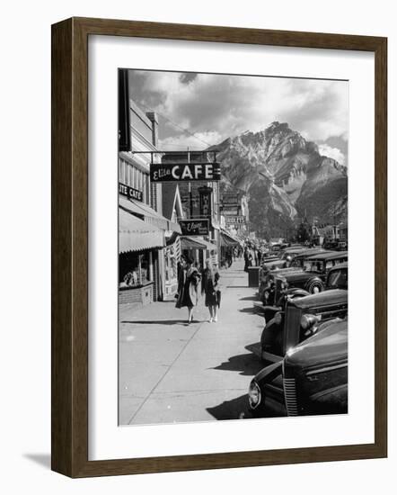 Pedestrians Walking Along Main Street in Resort Town with Cascade Mountain in the Background-Andreas Feininger-Framed Photographic Print